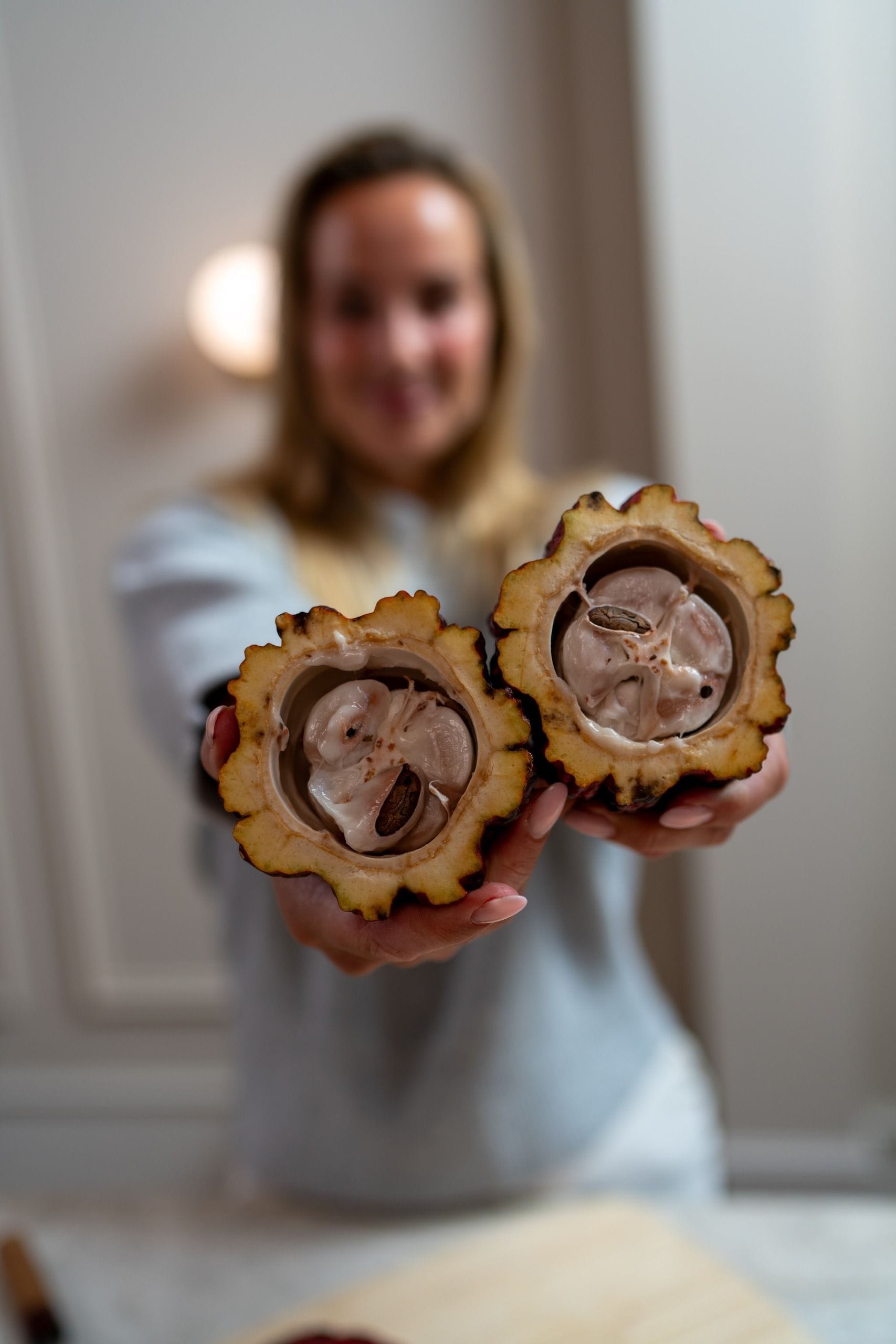 Woman holding cacaofruit 01