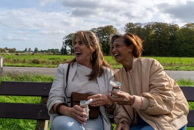 Women drinking elix outdoors